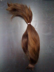 18 inch pony tail that was given to charity.